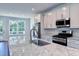 Modern kitchen with stainless steel appliances, granite countertops, and a breakfast bar at 509 Sherron Rd # 36, Raleigh, NC 27703