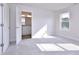 Bright main bedroom with a neutral color palette, large window, and ensuite bathroom at 509 Sherron Rd # 36, Raleigh, NC 27703