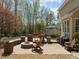 Well designed backyard featuring an outdoor dining and seating area, fire pit, and grilling space at 5125 Salinas Ct, Holly Springs, NC 27540