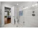 Bathroom featuring glass enclosed shower, toilet, and doorway to an adjacent bedroom at 5125 Salinas Ct, Holly Springs, NC 27540