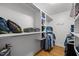 Walk-in closet with built-in shelving and ample storage space for clothing and accessories at 5125 Salinas Ct, Holly Springs, NC 27540
