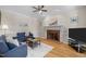 Cozy living room with fireplace, hardwood floors, and comfortable seating at 5125 Salinas Ct, Holly Springs, NC 27540