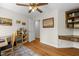 Well-lit office space with built-in shelving and hardwood floors at 5125 Salinas Ct, Holly Springs, NC 27540