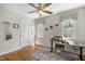 Bright office space with natural light, neutral colors, and golf clubs at 5125 Salinas Ct, Holly Springs, NC 27540