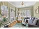 Cozy sunroom with ample natural light, comfortable seating, and views of the yard at 5125 Salinas Ct, Holly Springs, NC 27540