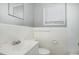 Compact bathroom with a white vanity, tiled walls, and a window with blinds at 5324 Rock Quarry Rd, Raleigh, NC 27610