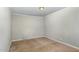 Bedroom with carpet floors, base trim, and neutral walls, providing a blank canvas at 5324 Rock Quarry Rd, Raleigh, NC 27610