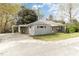 View of the side of a single story home with a covered parking area or carport at 5324 Rock Quarry Rd, Raleigh, NC 27610