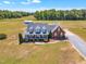 Stunning aerial view showcasing the home's expansive lot, manicured lawn, and charming architecture at 5595 Godwin Lake Rd, Benson, NC 27504