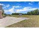 Expansive backyard featuring a concrete patio perfect for outdoor dining and entertainment, and large shed at 5595 Godwin Lake Rd, Benson, NC 27504