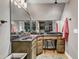 Bathroom featuring a vanity with black countertop, an oversized mirror, and overhead lighting at 5595 Godwin Lake Rd, Benson, NC 27504
