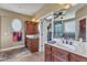 Elegant bathroom featuring a double sink vanity, and custom mirrors, providing a luxurious spa-like experience at 5595 Godwin Lake Rd, Benson, NC 27504