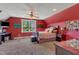 Cozy bedroom featuring carpet floors, ceiling fan, and an abundance of natural light at 5595 Godwin Lake Rd, Benson, NC 27504