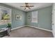 This charming bedroom features neutral carpet, two large windows for natural light, and a ceiling fan at 5595 Godwin Lake Rd, Benson, NC 27504