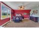Bedroom featuring carpet floors, natural light, and comfortable decor at 5595 Godwin Lake Rd, Benson, NC 27504