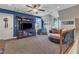 Spacious bonus room with TV, plush seating, cozy design, and a ceiling fan at 5595 Godwin Lake Rd, Benson, NC 27504
