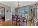 Charming dining room with hardwood floors and a large window providing natural light at 5595 Godwin Lake Rd, Benson, NC 27504