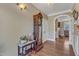Hallway with hardwood flooring, trim, and views to a sitting room and living space at 5595 Godwin Lake Rd, Benson, NC 27504