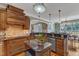 Gourmet kitchen boasts granite countertops, custom wood cabinetry, and a stylish island at 5595 Godwin Lake Rd, Benson, NC 27504