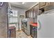 Functional laundry room equipped with modern washer and dryer units, ample cabinet space, and a convenient utility sink at 5595 Godwin Lake Rd, Benson, NC 27504