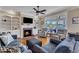 Comfortable living room with a fireplace, built-in shelving, and backyard views at 5595 Godwin Lake Rd, Benson, NC 27504