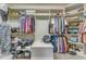 Organized walk-in closet with ample shelving, hanging rods, and storage, perfect for keeping your wardrobe tidy at 5595 Godwin Lake Rd, Benson, NC 27504