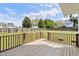 The house has a wooden deck that overlooks the expansive backyard at 5745 Spence Farm Rd, Holly Springs, NC 27540