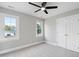 Bedroom with lots of natural light, ceiling fan, and closet at 5745 Spence Farm Rd, Holly Springs, NC 27540