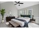 Spacious bedroom features a ceiling fan, bench, and plenty of natural light at 5745 Spence Farm Rd, Holly Springs, NC 27540