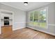Bright dining room with hardwood floors and a view of the backyard at 5745 Spence Farm Rd, Holly Springs, NC 27540