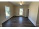 Bedroom with neutral walls, two windows for natural light, and light wood flooring at 602 Dexter St, Rocky Mount, NC 27803