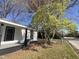 Charming home exterior with light siding, black trim, and mature landscaping at 602 Dexter St, Rocky Mount, NC 27803