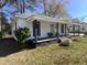 Charming single-story home featuring a welcoming front porch with dark columns and a well-maintained front yard at 602 Dexter St, Rocky Mount, NC 27803