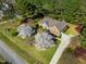 Stunning aerial view of the home with flowering trees in the well-manicured front yard at 6521 Vintage Ridge Ln, Fuquay Varina, NC 27526
