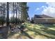 Backyard with fire pit area and lush green lawn, perfect for outdoor enjoyment at 6521 Vintage Ridge Ln, Fuquay Varina, NC 27526