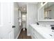 Bathroom featuring double sinks, tile backsplash, and modern fixtures at 6521 Vintage Ridge Ln, Fuquay Varina, NC 27526