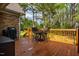 Relaxing wood deck overlooking the backyard and outdoor dining area with table and chairs at 6521 Vintage Ridge Ln, Fuquay Varina, NC 27526