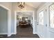 Elegant entryway with hardwood floors leading into a dining room at 6521 Vintage Ridge Ln, Fuquay Varina, NC 27526