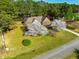 Beautiful home with flowering trees, well-manicured lawn, and mature trees in a desirable neighborhood at 6521 Vintage Ridge Ln, Fuquay Varina, NC 27526