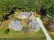 Charming home featuring flowering trees, manicured lawn, long drive, and inviting curb appeal at 6521 Vintage Ridge Ln, Fuquay Varina, NC 27526