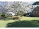 Beautiful brick home with large front yard and mature blossoming trees at 6521 Vintage Ridge Ln, Fuquay Varina, NC 27526
