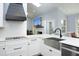 Open concept living space with a chef's kitchen, stainless steel appliances, and a fireplace at 6521 Vintage Ridge Ln, Fuquay Varina, NC 27526
