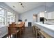 Bright eat-in kitchen with hardwood floors, island with bar seating, and stainless steel appliances at 6521 Vintage Ridge Ln, Fuquay Varina, NC 27526