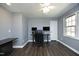 Home office with hardwood floors, neutral walls, and modern desk setup at 6521 Vintage Ridge Ln, Fuquay Varina, NC 27526