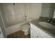 Bathroom featuring a single sink vanity with granite countertop and shower over tub at 74 Harvest Hills Ln, Dunn, NC 28334
