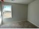 Bedroom with large window looking out to a grassy field at 74 Harvest Hills Ln, Dunn, NC 28334