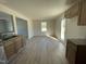 Modern kitchen with light wood cabinets, granite countertops and open floorplan at 74 Harvest Hills Ln, Dunn, NC 28334