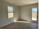 Sunny living area with lots of light and a door leading to the outside at 74 Harvest Hills Ln, Dunn, NC 28334