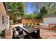 Enjoy outdoor dining on this beautiful backyard deck with a view of the lush green landscape at 7616 Valley Run Dr, Raleigh, NC 27615