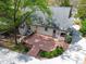 Aerial view of the backyard revealing a spacious wooden deck and charming landscaping, perfect for outdoor living at 7616 Valley Run Dr, Raleigh, NC 27615